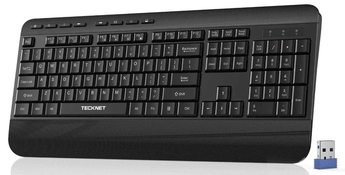 Black full-size wireless keyboard with integrated wrist rest and foldable feet
