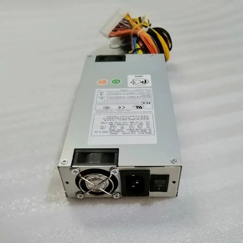 Silver 1U industrial power supply unit with fan grille and rear connector panel