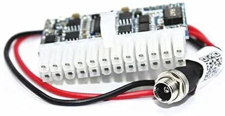 Tiny blue or green PCB with white or black 24-pin ATX connector and DC jack