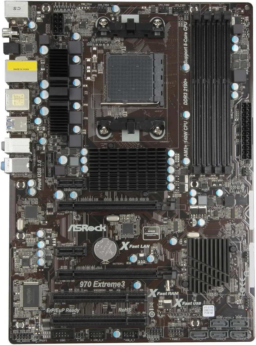 ATX motherboard in black and blue with silver heatsinks and multiple expansion slots