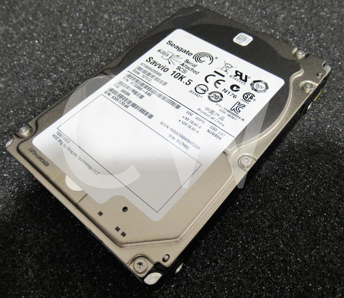 Silver 2.5 inch SAS hard drive with green circuit board visible on underside