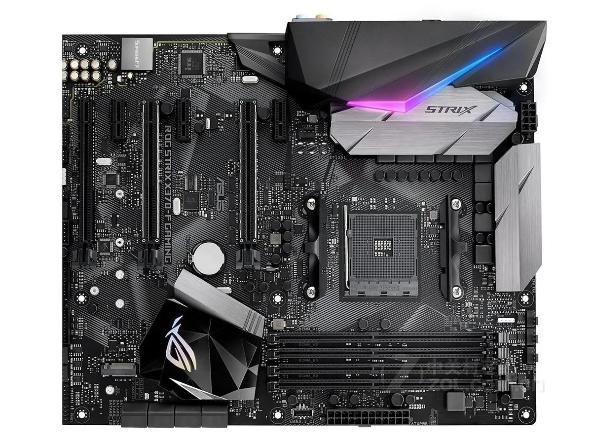ATX motherboard with black PCB and silver heatsinks