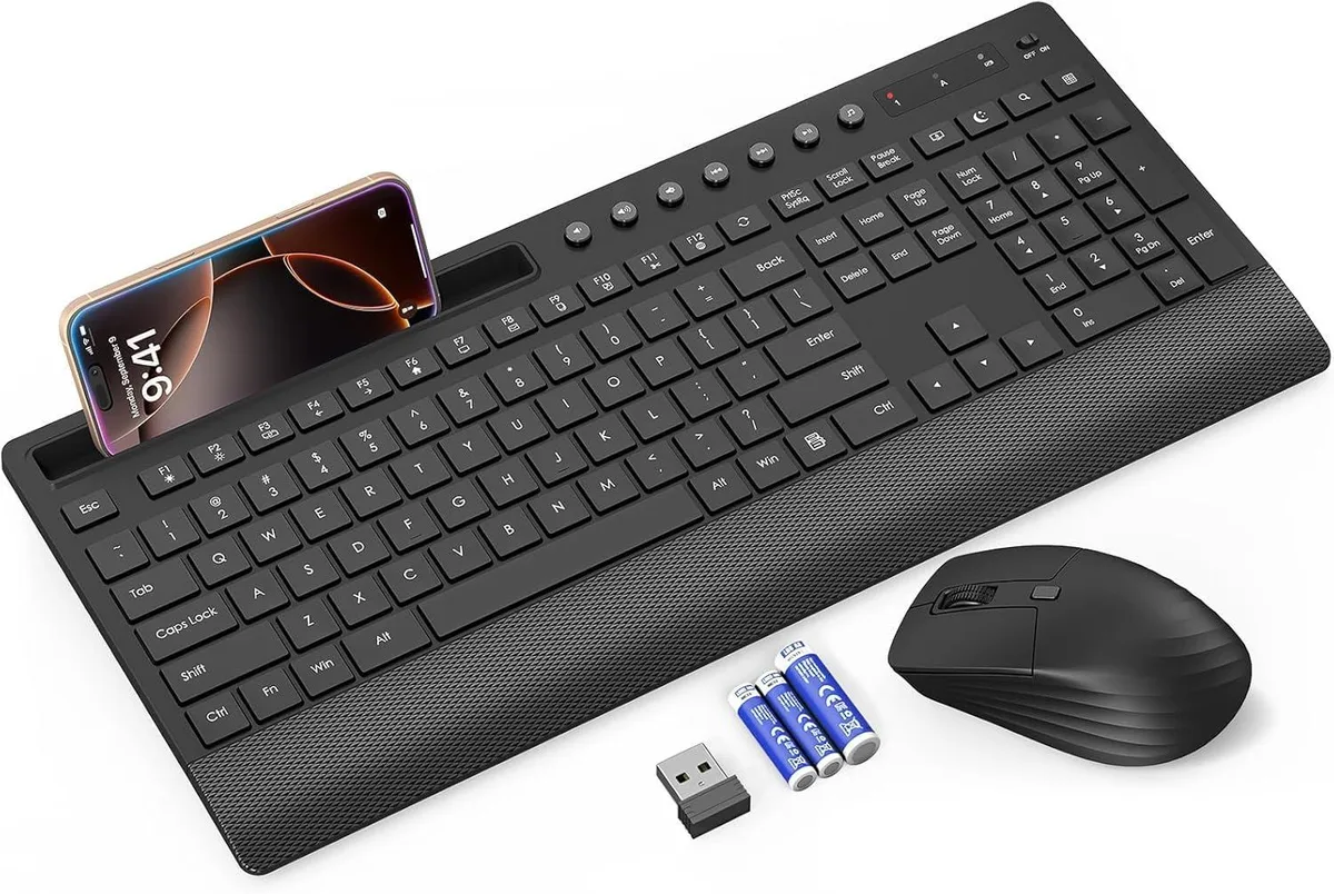 Black full-size wireless keyboard with palm rest, phone holder, and matching mouse