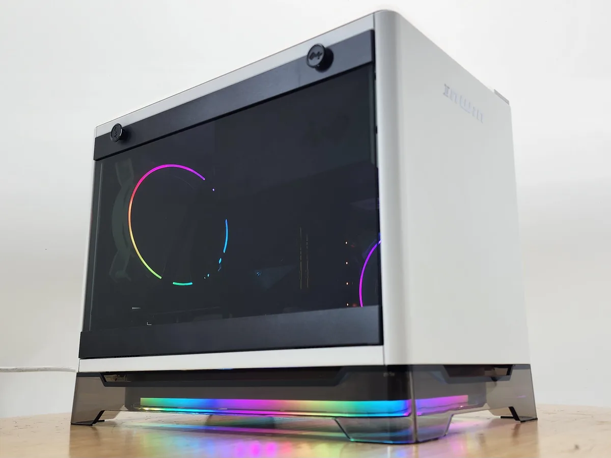 White mini-ITX case with Asetek AIO cooler visible inside