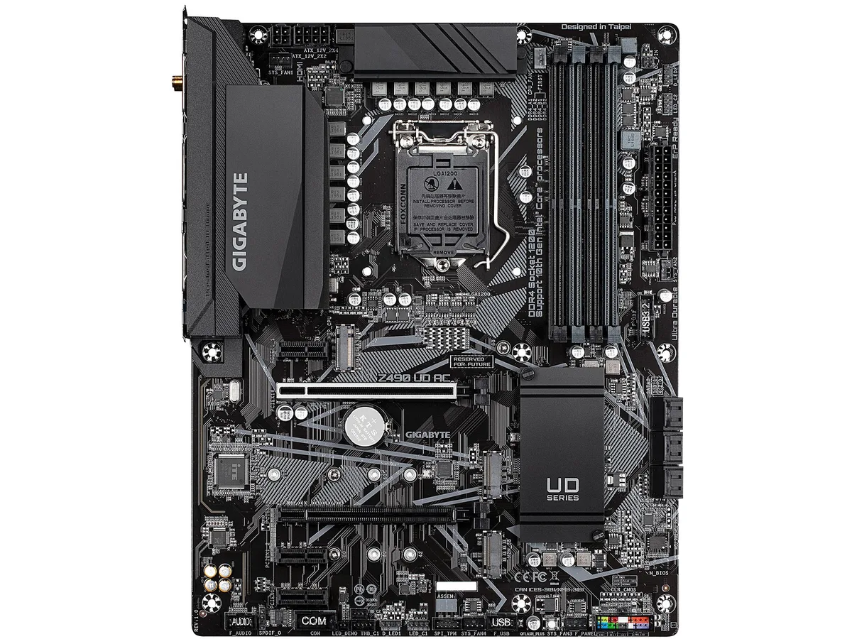 ATX motherboard in black with silver heatsinks and rear I/O panel