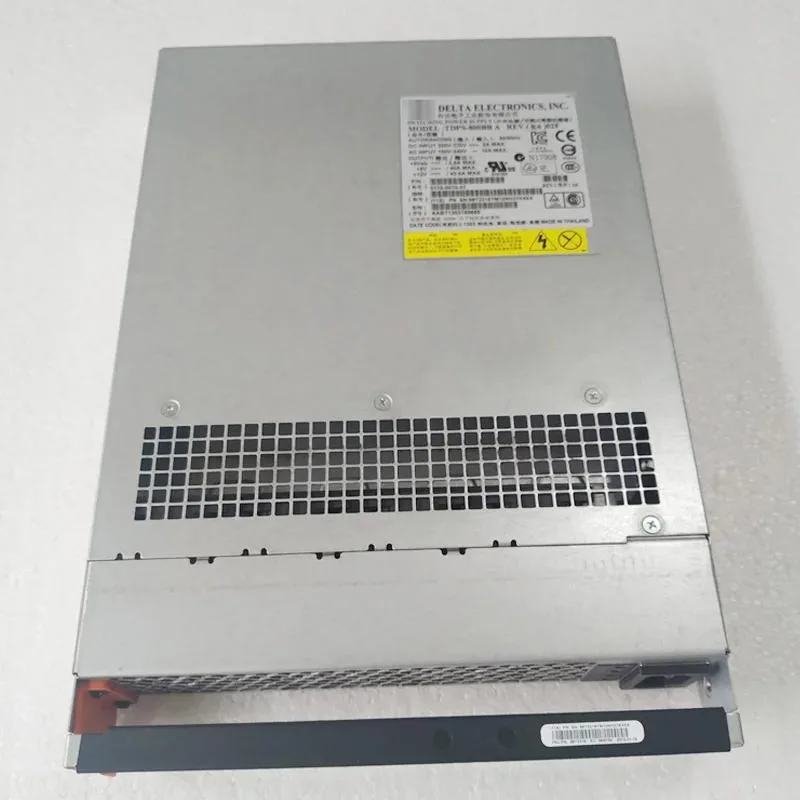 Rectangular metal ATX power supply unit with ventilation grill and label showing model numbers