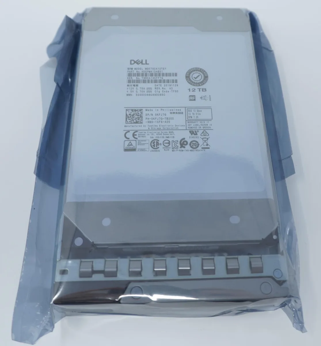 3.5 inch SAS hard drive in silver metal caddy