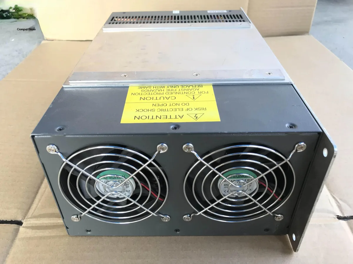 Rectangular silver ATX power supply unit with ventilation grille and rear power socket