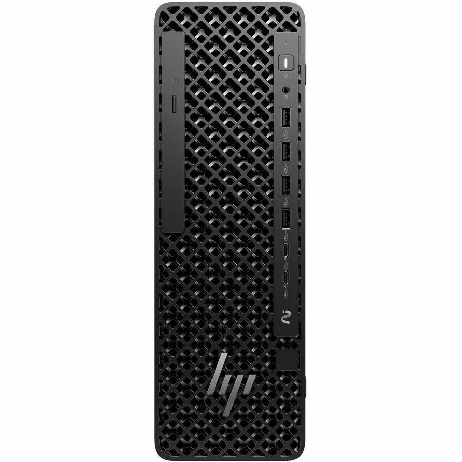 Black small-form-factor workstation tower with wired keyboard and mouse