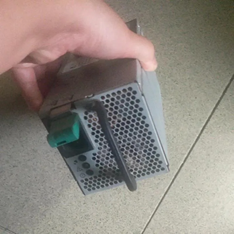 Rectangular ATX power supply unit, matte metal finish, fan grille visible