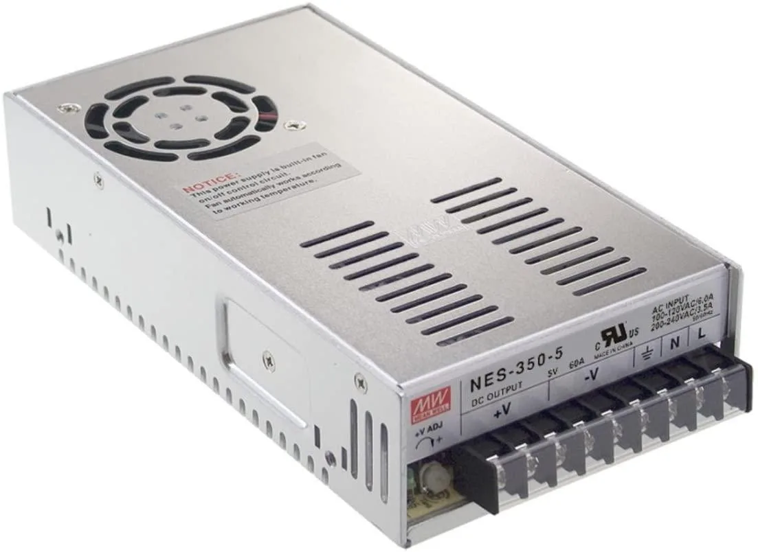 Rectangular metal enclosed power supply unit with ventilation slots and terminal connections
