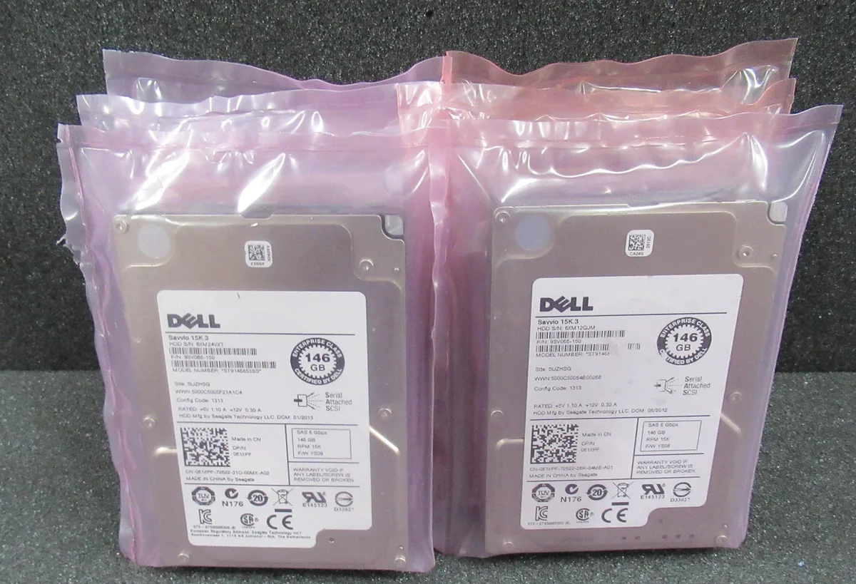Seven new Dell 2.5 inch SAS hard drives in silver metal casings