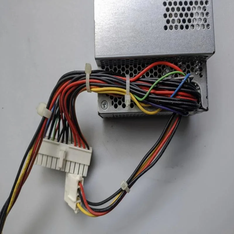 Black rectangular ATX power supply unit with fan grille and cables