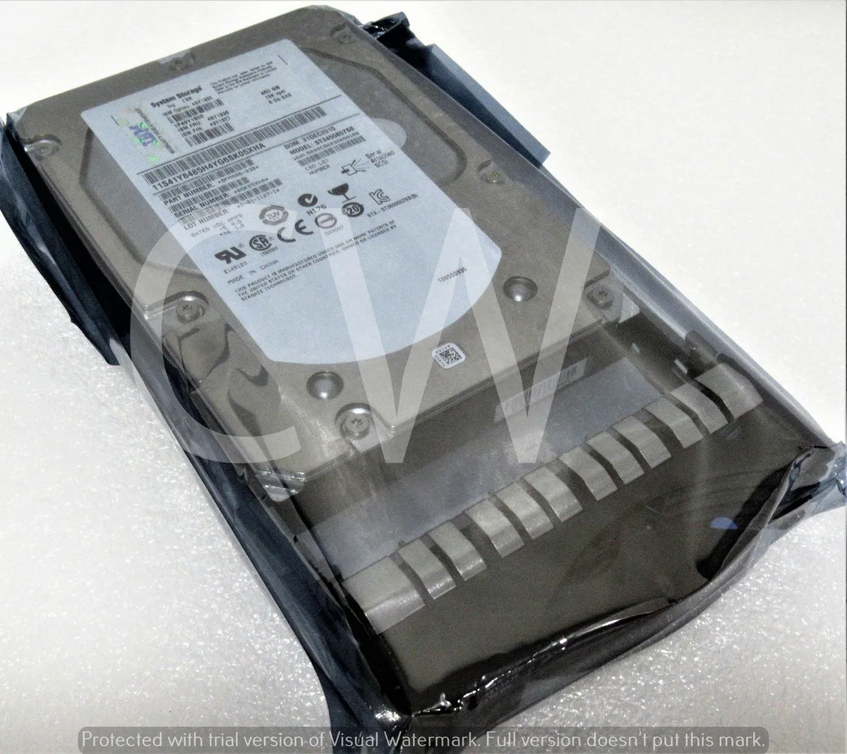 3.5 inch SAS hard drive in silver metal caddy