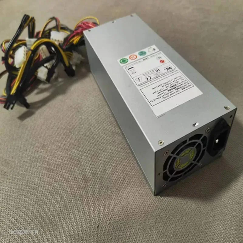 Rectangular silver ATX power supply unit with cooling fan grille and cable connectors