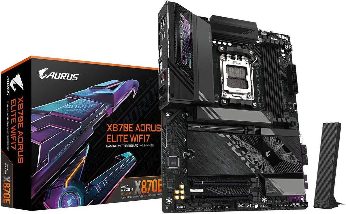 ATX motherboard in dark grey with silver heatsinks and rear I/O shield