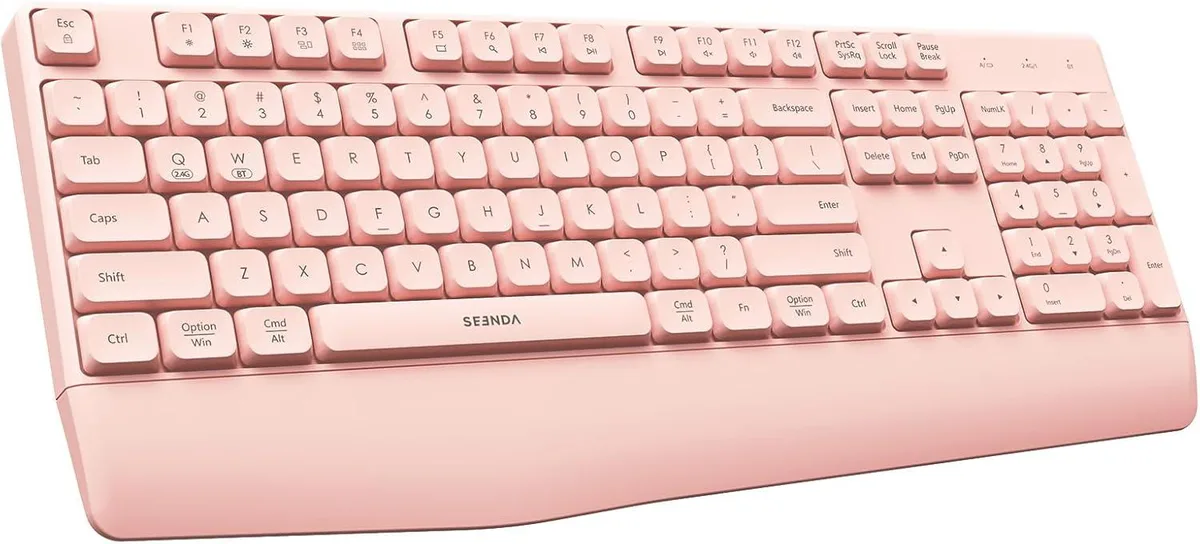 Pink full-size wired keyboard with integrated wrist rest and 65inch USB cable