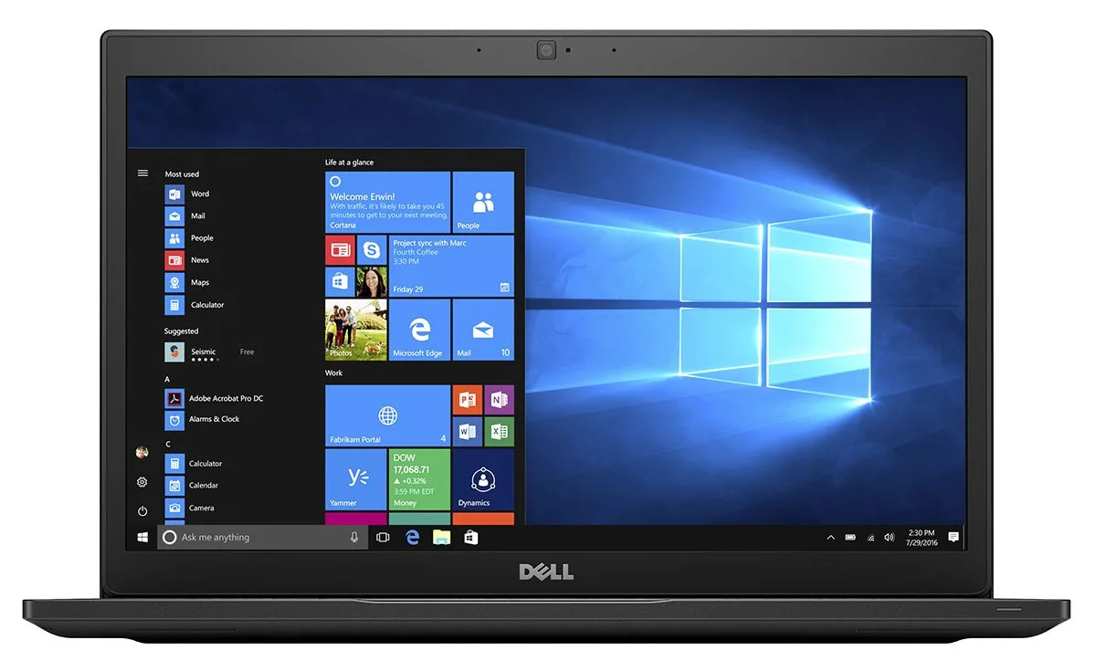 Silver 14 inch business laptop closed showing Dell logo on lid