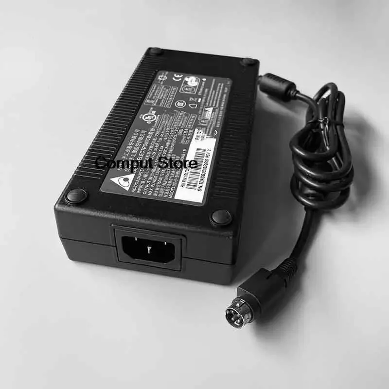 Rectangular black ATX power supply unit with label showing 12V 12.5A