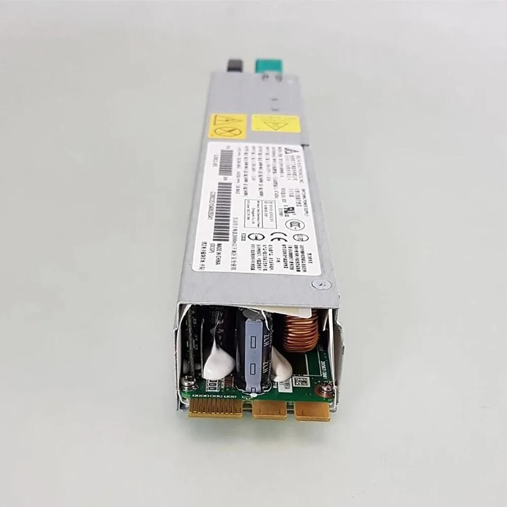Silver rectangular server power supply unit with ventilation grille and label showing model numbers