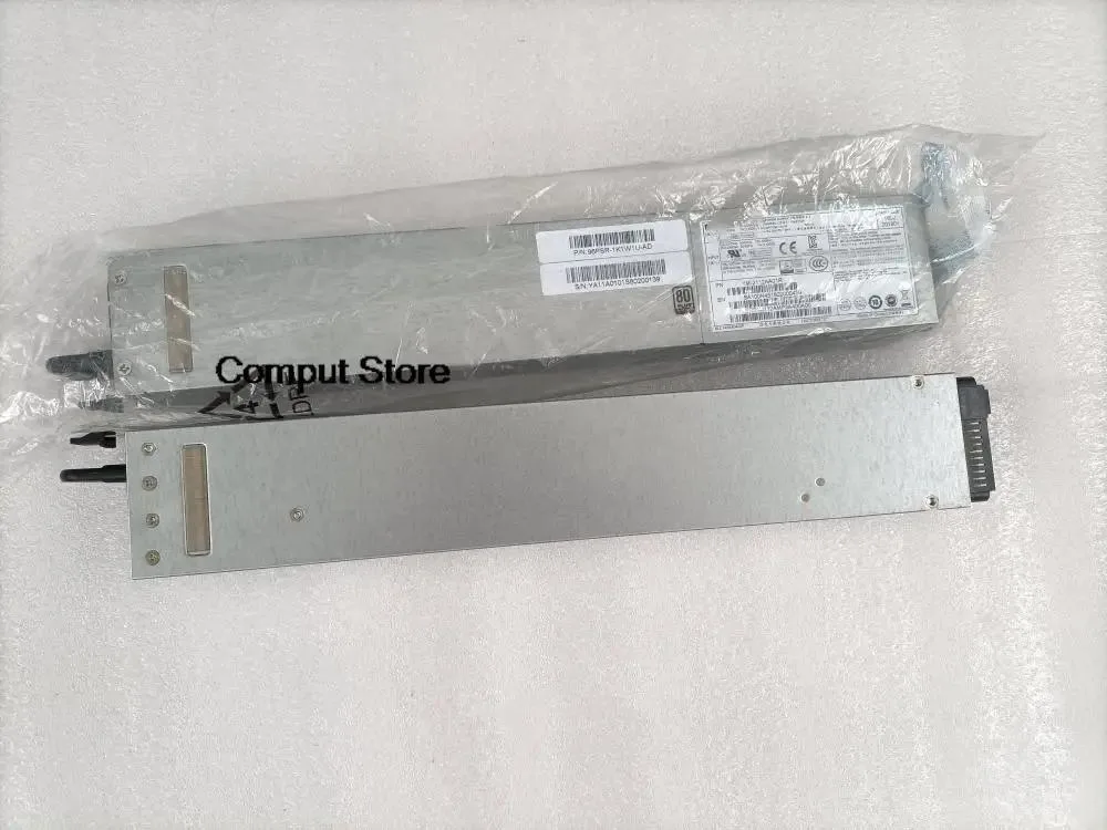 Silver ATX power supply unit with ventilation grille and power socket