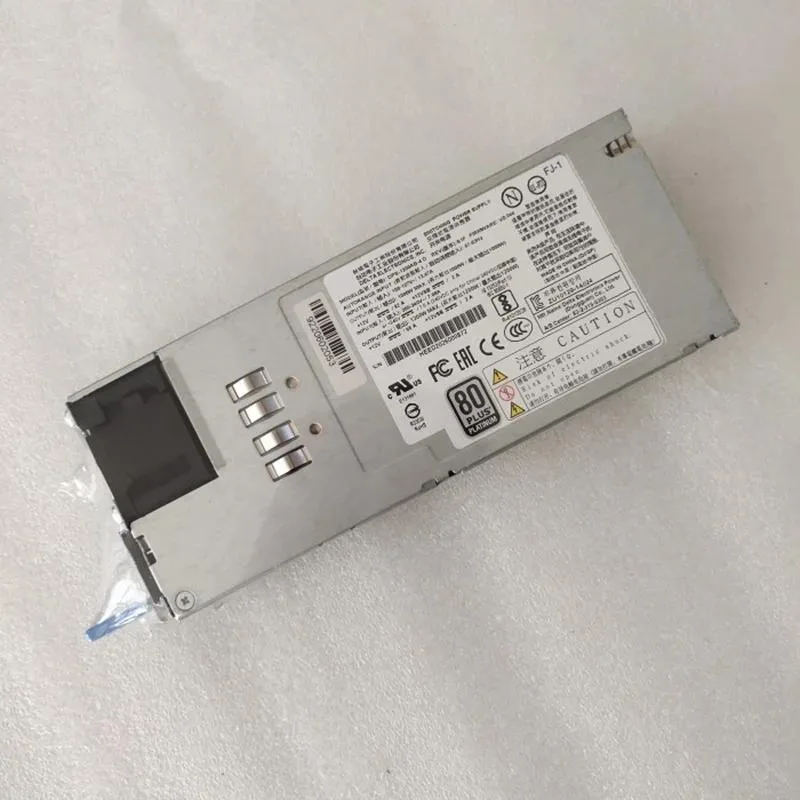Rectangular silver ATX power supply unit with ventilation grille and power connectors