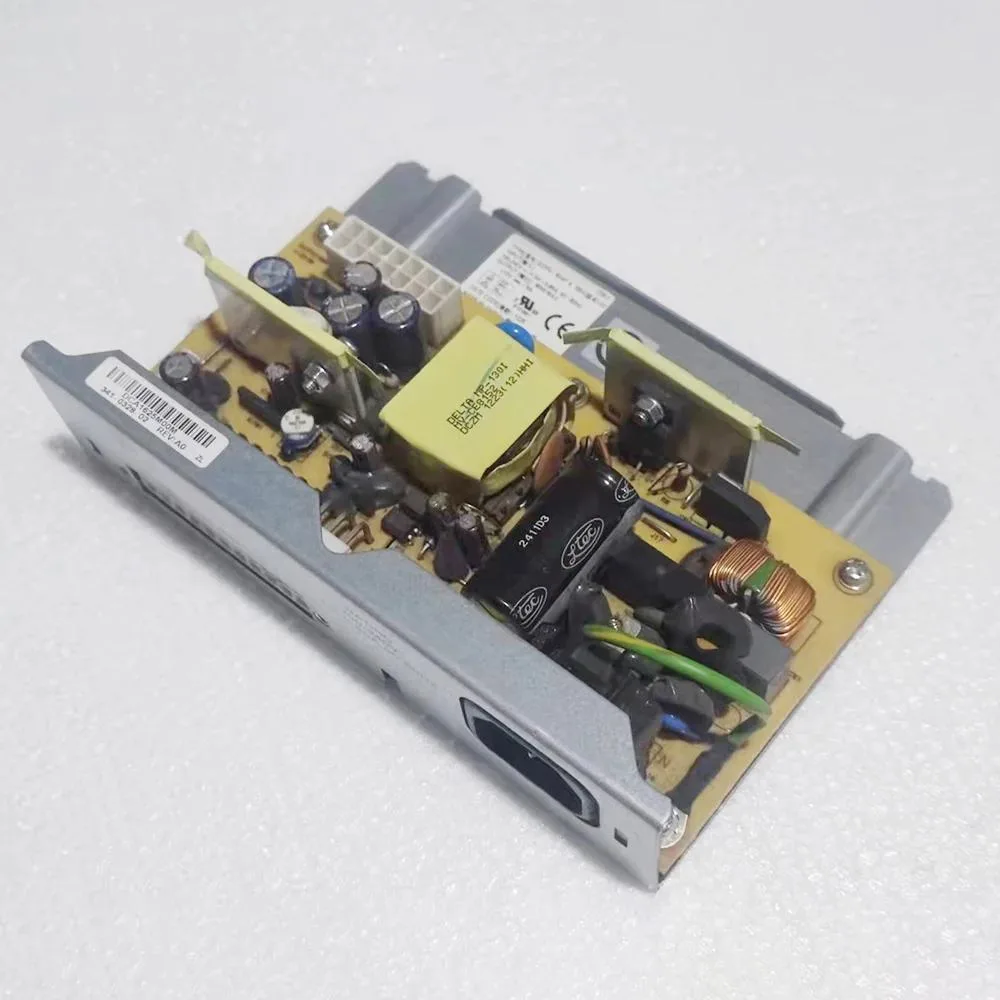Rectangular silver metal power supply unit with ventilation slots and label showing 60W