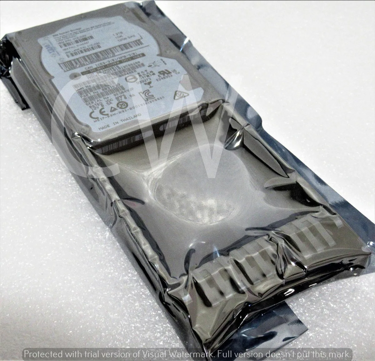 Small silver 2.5 inch SAS hard drive mounted in black plastic caddy tray