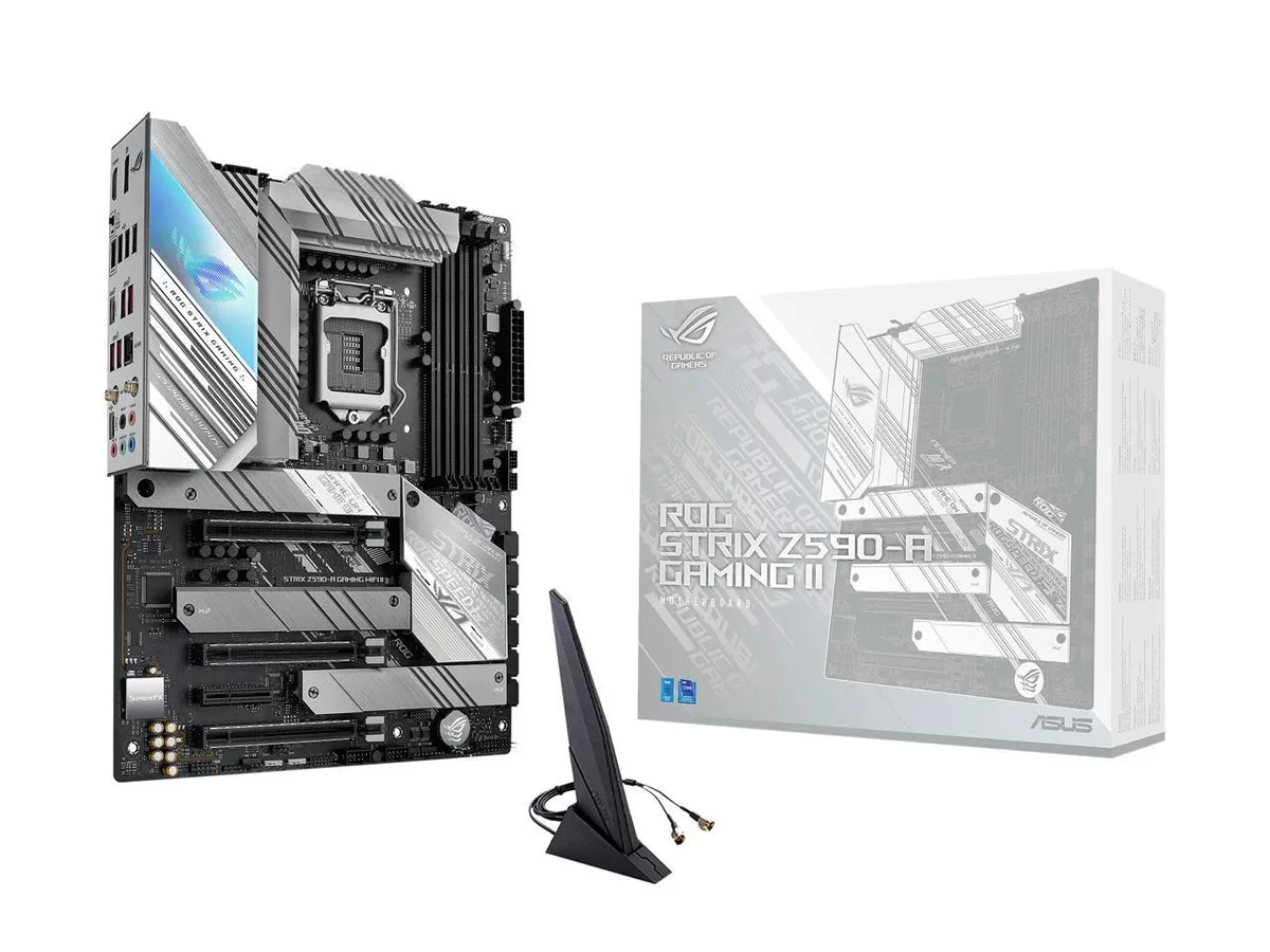 ATX motherboard, black PCB with silver heatsinks, white ROG lettering, pre-mounted I/O shield