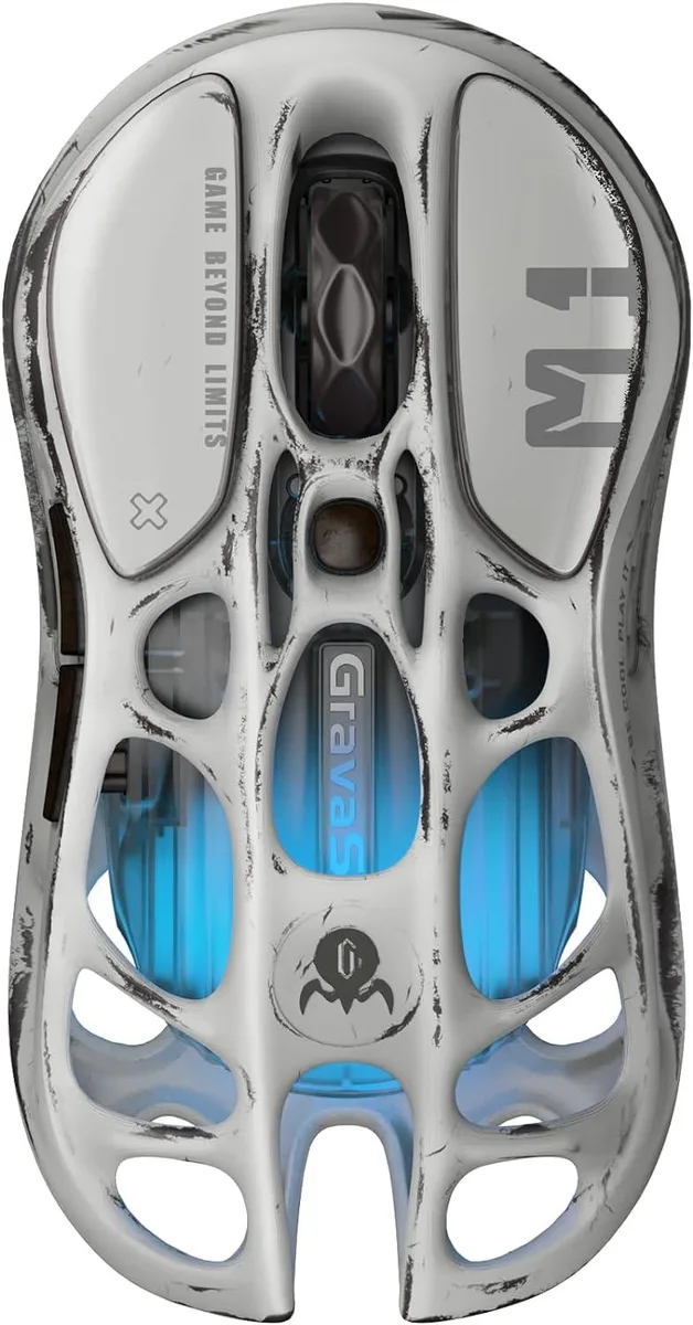Silver magnesium alloy gaming mouse with hollowed-out shell and RGB lighting