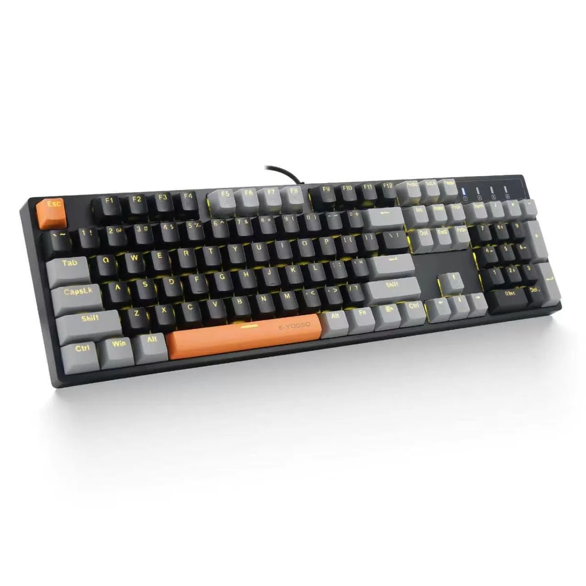 Black and grey full-size wired mechanical keyboard with yellow LED backlighting and two orange replacement keycaps
