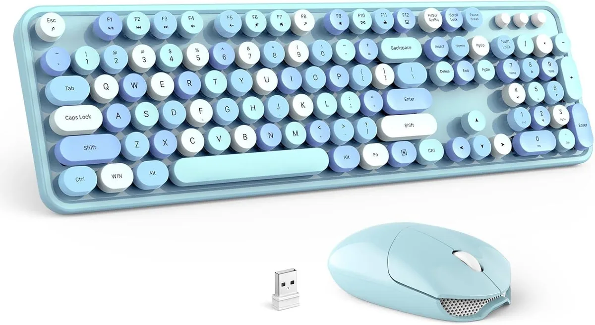 Sky blue full-size wireless keyboard with round keycaps and matching mouse, USB receiver stored in mouse