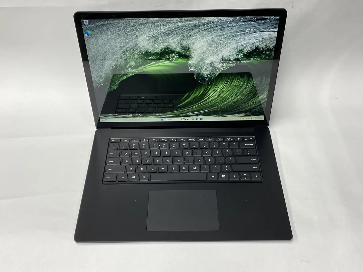 Silver aluminium 15 inch touchscreen laptop, clean minimalist design, charger included