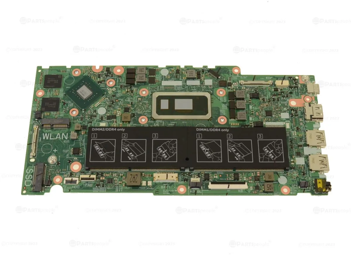 Green Dell motherboard with silver CPU cooler and black GPU chip