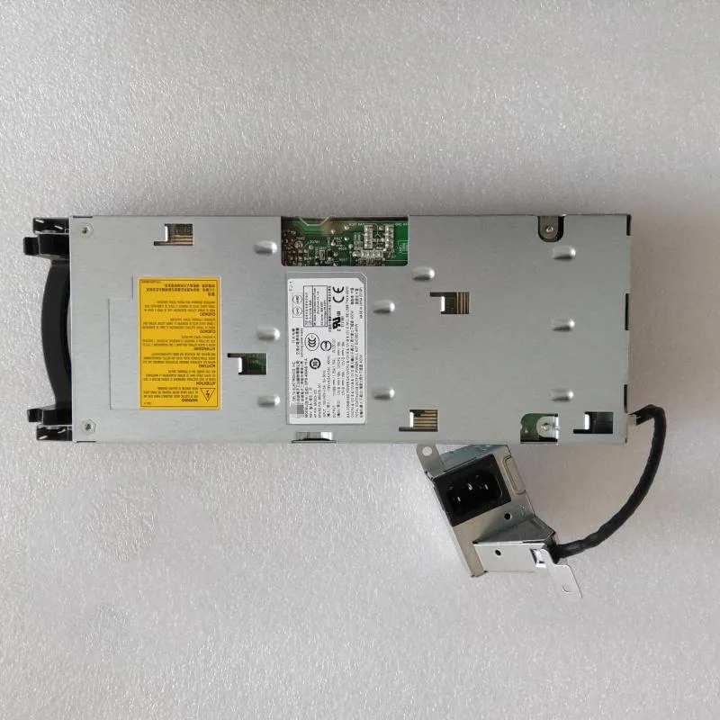 Rectangular metal ATX power supply unit with ventilation grille and label showing model numbers