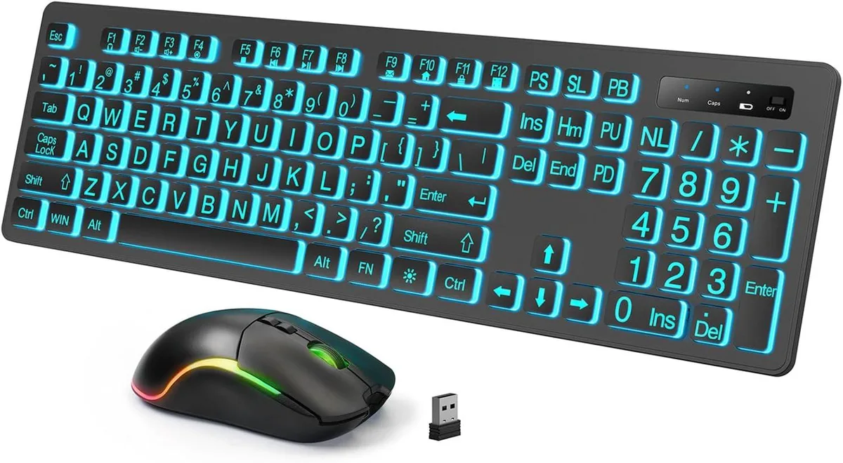 Black full-size wireless keyboard with large backlit keys and matching contoured mouse on desk