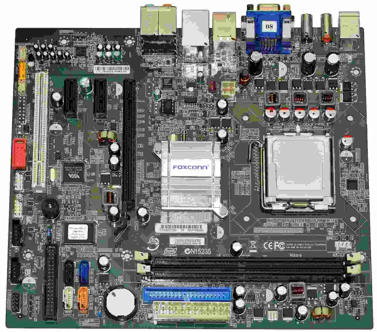 Green rectangular motherboard with silver CPU socket and DDR2 memory slots