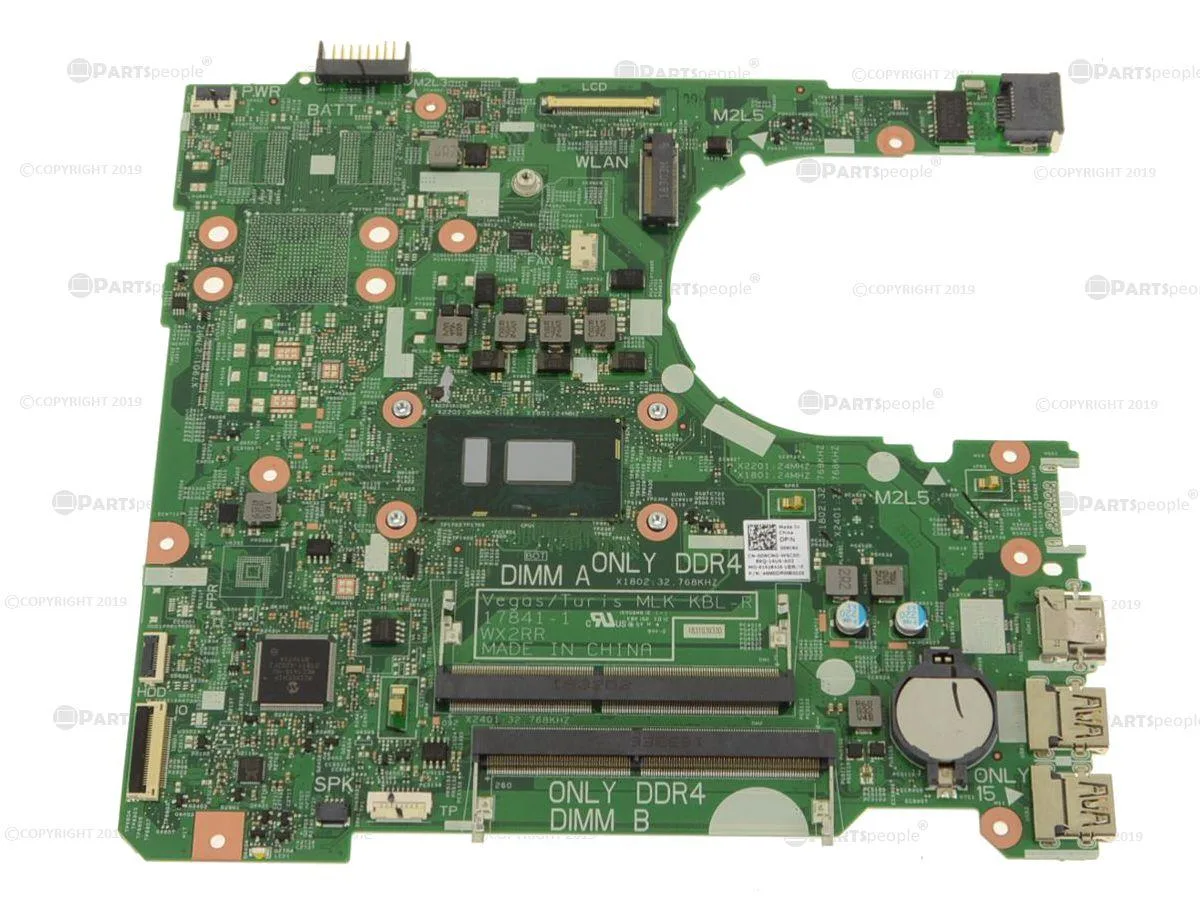 Green laptop motherboard with silver CPU socket and black components
