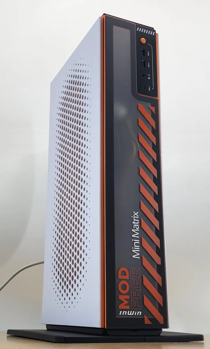 Compact black gaming desktop tower with front mesh panel