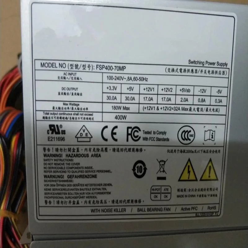 Rectangular ATX power supply unit, matte black metal casing, rear fan grille and power socket visible