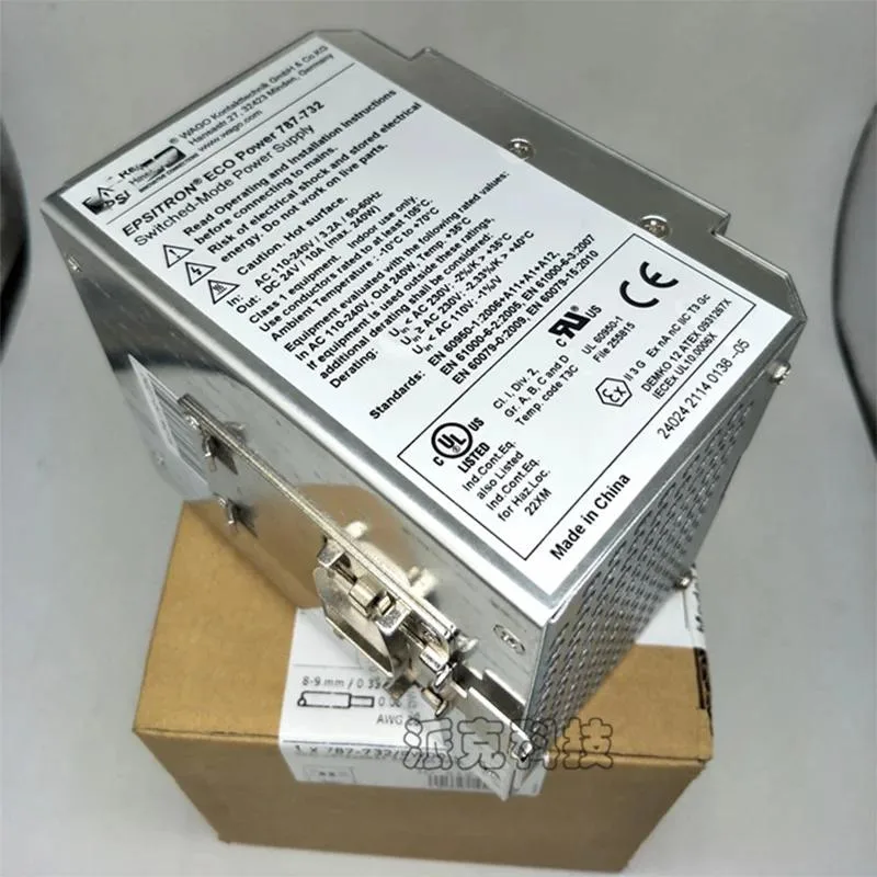Rectangular metal power supply unit with ventilation slots and terminal connections
